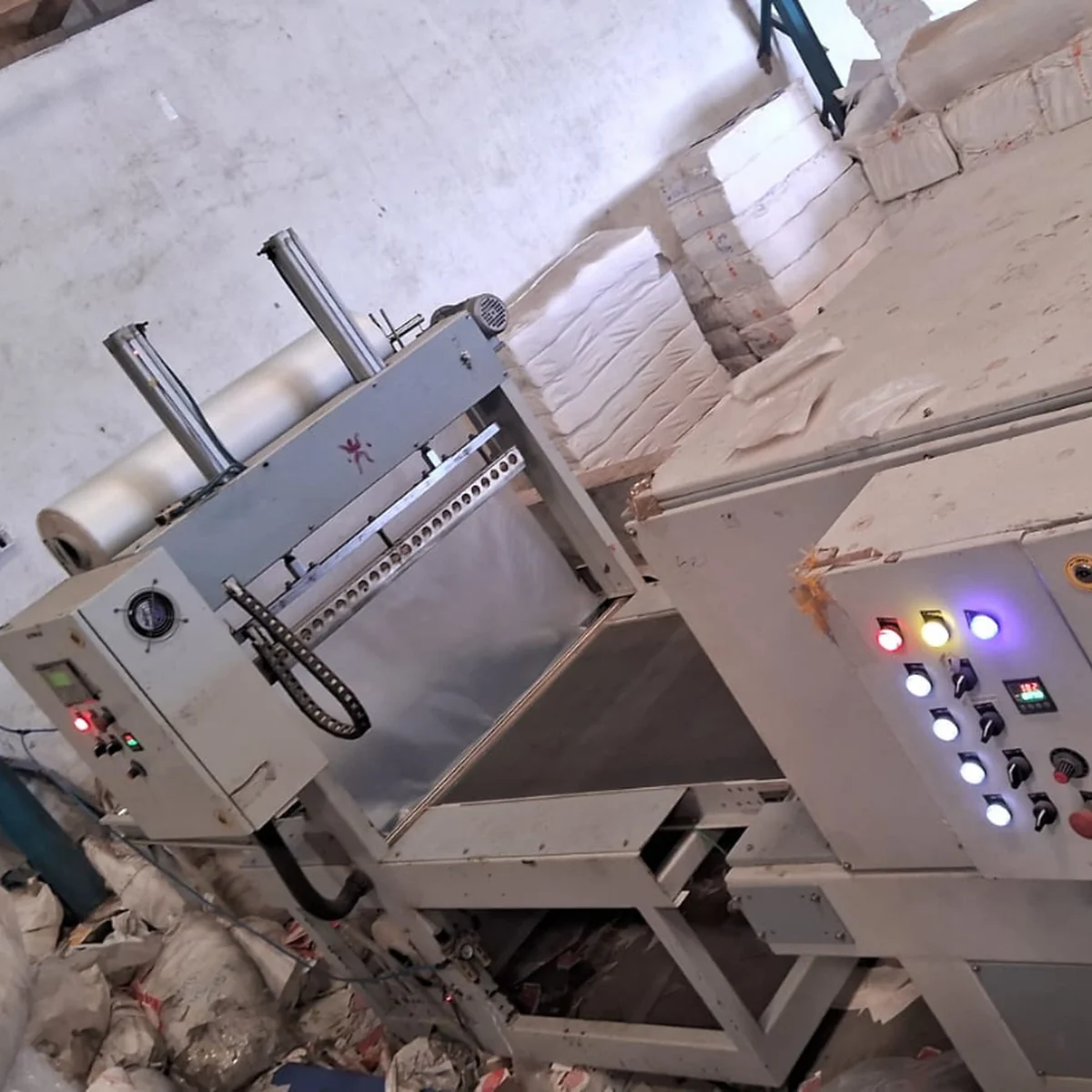 Automatic Web Sealer with Shrink Tunnel machine by Arbuda Packaging Machinery
