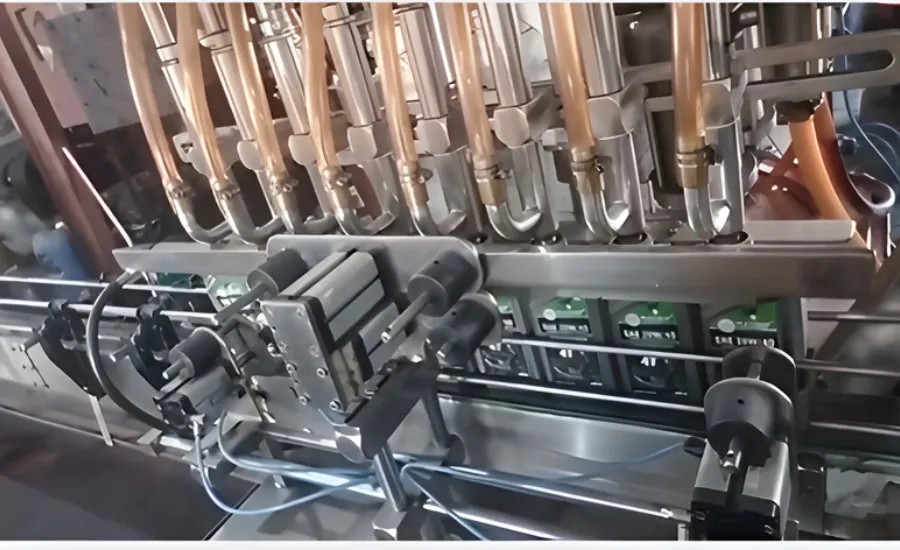 MachineCraft Lubricant Filling Machine detail view of capping mechanism