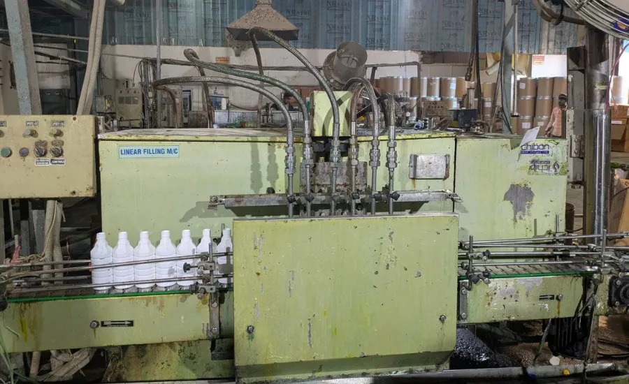 Volumetric piston filler side view – SurplusPack